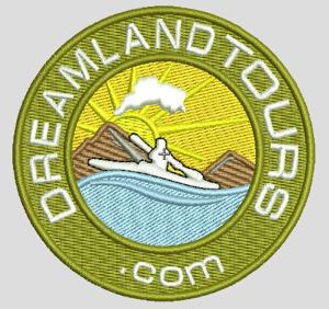 a yellow badge with a ship in the water at Camp in Santa Teresa