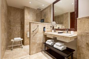 a bathroom with a sink and a shower at Grand Palladium Imbassaí Resort & Spa - All Inclusive in Imbassai