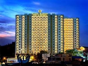 a large building with a sign on top of it at Nagoya Mansion Apart Trw B in Nagoya