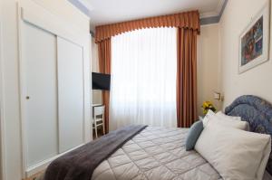 Posteľ alebo postele v izbe v ubytovaní Hotel Villa Erica