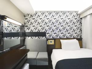 Voodi või voodid majutusasutuse APA Hotel Hatchobori Ekimae toas