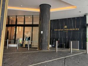 a building with a pillar in front of a store at Star above, Ocean Beyond - Lv 43 Luxury Apartment with Panoramic View on The Star Casino Broadbeach in Gold Coast +46 photos