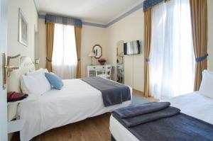 Posteľ alebo postele v izbe v ubytovaní Hotel Villa Erica
