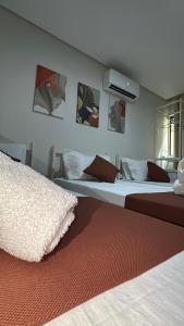 Cama ou camas em um quarto em Sr Hotel