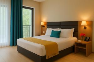 Кровать или кровати в номере Eleven Inn Tbilisi