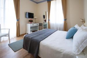 Posteľ alebo postele v izbe v ubytovaní Hotel Villa Erica