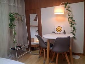 a dining room with a table and two chairs at Comfort House 2 bed room Hwagok Station 4minutes Gimpo Airport 10 minutes in Seoul +38 photos