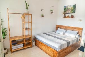 Postel nebo postele na pokoji v ubytování Indonesia Eco Tour Homestay