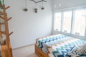 Postel nebo postele na pokoji v ubytování Indonesia Eco Tour Homestay