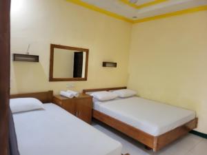 Katil atau katil-katil dalam bilik di Koi Gili Guest House