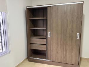 a closet with wooden doors in a room at Departamento Céntrico San Martín in San Martín