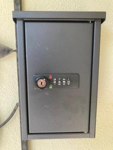 a black box with a control panel on a wall at Hosts offer Single Bed accommodation to Suit Single Travellers in Swan Hill