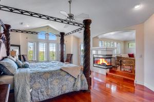 a bedroom with a bed and a fireplace at Colorado Lux Peace & Love Top 2 Floors Only in Aurora