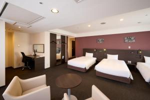 Кровать или кровати в номере Smile Hotel Kyoto Shijo