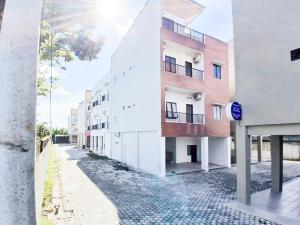 an empty street in front of a building at Urbanview Hotel Manggala Maguwoharjo in Kalasan