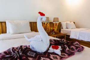 Una cama o camas en una habitación de Murex Dive Resort