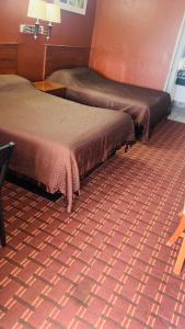 Postel nebo postele na pokoji v ubytování Executive Inn Robstown