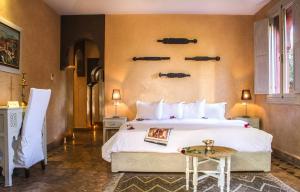 Postel nebo postele na pokoji v ubytování Palais El Miria & SPA