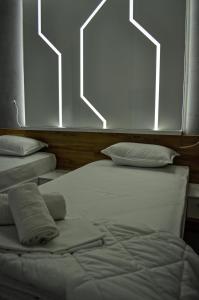Voodi või voodid majutusasutuse Apartments Good Night toas