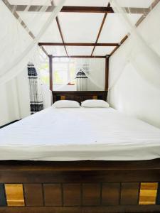 Ένα ή περισσότερα κρεβάτια σε δωμάτιο στο Crystal Villa