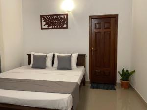 Postel nebo postele na pokoji v ubytování BlissFam Villa & Hostel