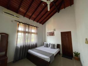 Postel nebo postele na pokoji v ubytování BlissFam Villa & Hostel