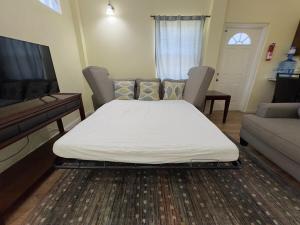 Una cama o camas en una habitación de Itopia
