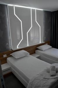 Voodi või voodid majutusasutuse Apartments Good Night toas