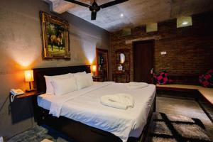 Postel nebo postele na pokoji v ubytování Aayu Hanthana Boutique Hotel