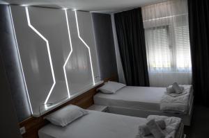 Voodi või voodid majutusasutuse Apartments Good Night toas