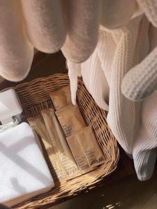 a basket filled with towels and a blanket at ViewNaaBaan At Phamee in Ban Pha Mi +52 photos