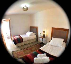 Postel nebo postele na pokoji v ubytování Hotel Boutique Molzano