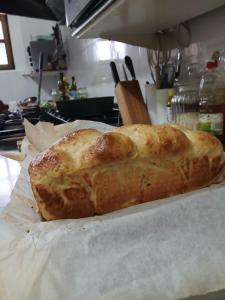 a loaf of bread sitting on a counter in a kitchen at ALBERGUE peregrinos CASAFLOR in Murias de Rechivaldo
