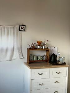 a kitchen with a cabinet with a counter top at ViewNaaBaan At Phamee in Ban Pha Mi +52 photos