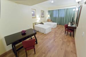 Dayrell Hotel e Centro de Convenções客房内的一张或多张床位