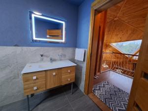 a bathroom with a sink and a mirror at HOLIDAY VILLA''Dome Retreat'', Burgas area in Livada +48 photos