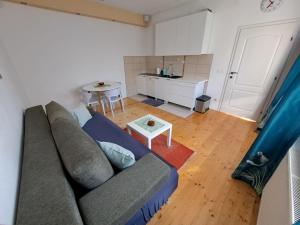 a living room with a couch and a table at Dona 2 in Sarajevo