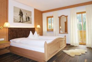 Rúm í herbergi á Hotel Gallia