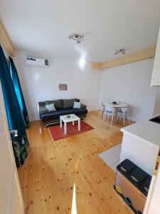 a living room with a couch and a table at Dona 2 in Sarajevo