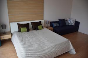 Posteľ alebo postele v izbe v ubytovaní Aqua Apartman Panoráma