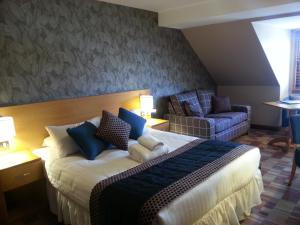 Letto o letti in una camera di Greyfriars Inn by Greene King Inns