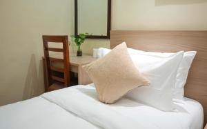 Postel nebo postele na pokoji v ubytování Budhanilkantha Homestay