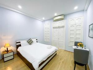 Postel nebo postele na pokoji v ubytování Eco Nest Hotel Đình Ngang