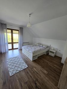 Posteľ alebo postele v izbe v ubytovaní BIESCZADNIK