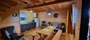 a kitchen and dining room with a table and chairs at La Merveille 795-848-628 in Solina