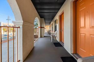 an internal corridor of a building with a balcony at Travelodge by Wyndham Hotel & Cottages St Augustine - Historic in Saint Augustine