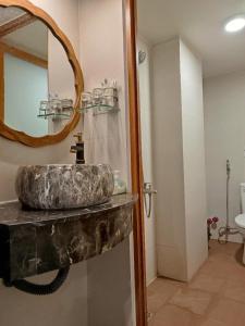 a bathroom with a sink and a mirror at A&E Guesthouse in Ho Chi Minh City +48 photos
