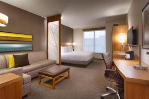 a hotel room with a couch and a bed at Hyatt Place Park City in Park City