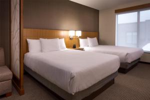 a hotel room with two beds and a window at Hyatt Place Park City in Park City