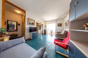 a living room with a couch and a chair at Vista mare,Residence albatross in Lido Adriano